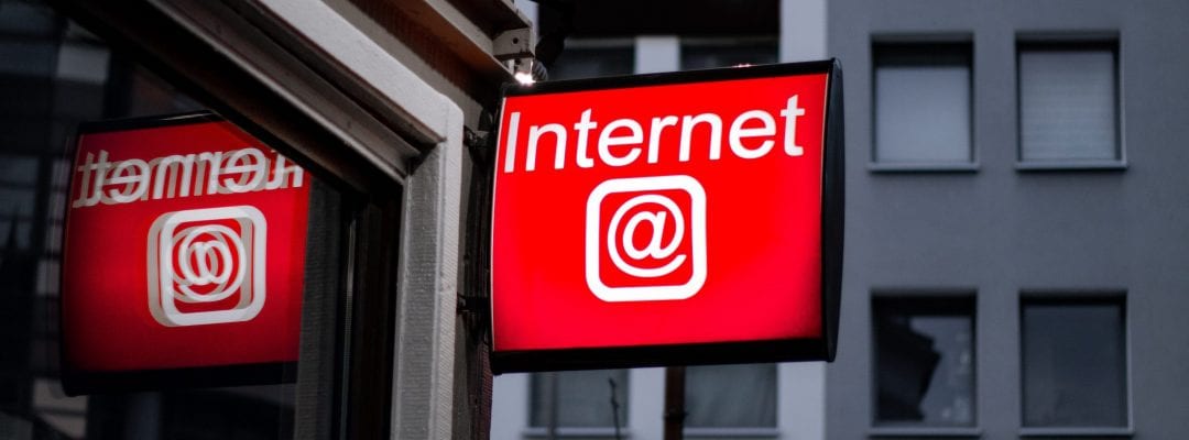 Internet cafe sign underlining on-line tutoring credentials